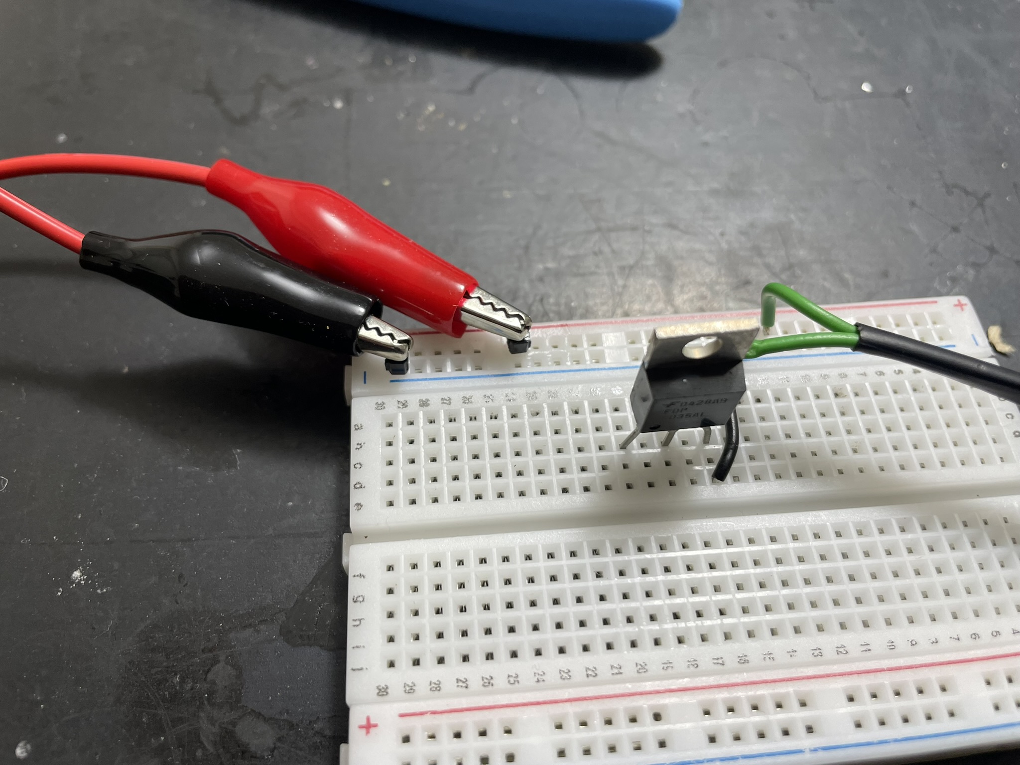 A breadboard with various electronic components and jumper wires, likely part of an ongoing project.