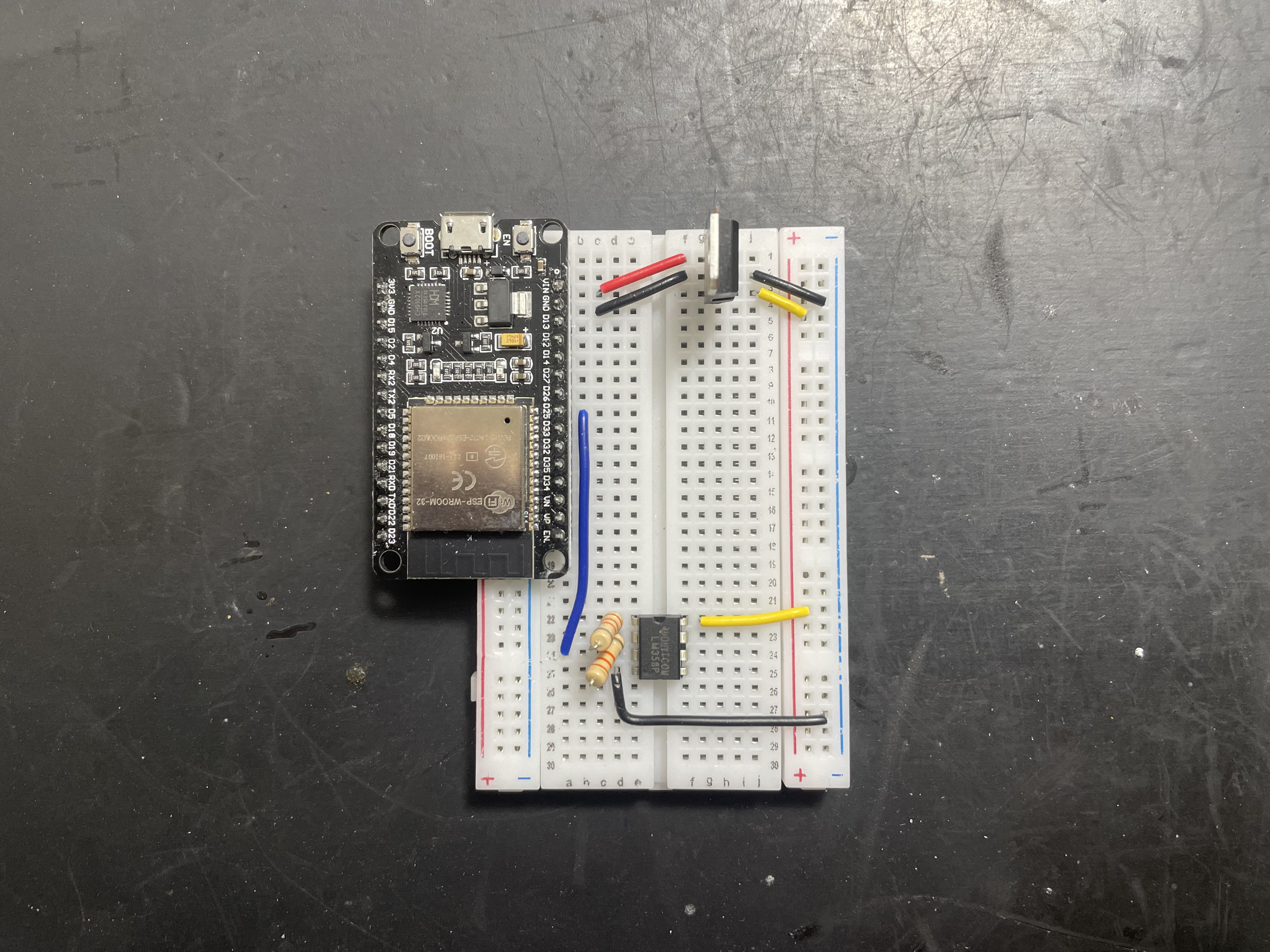 ESP32 on a breadboard with an Op-Amp to double its DAC output signal.