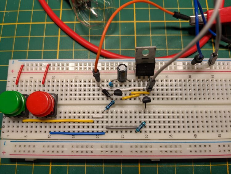A bootstrap circuit for driving a high side MOSFET. It uses a diode to charge the capacitor when a signal is pulled low and MOSFET source is near ground level. This same low signal also has the bottom PNP transistor empty the gate into source. A second signal pulled low connects the capacitor to the gate to switch the MOSFET on.