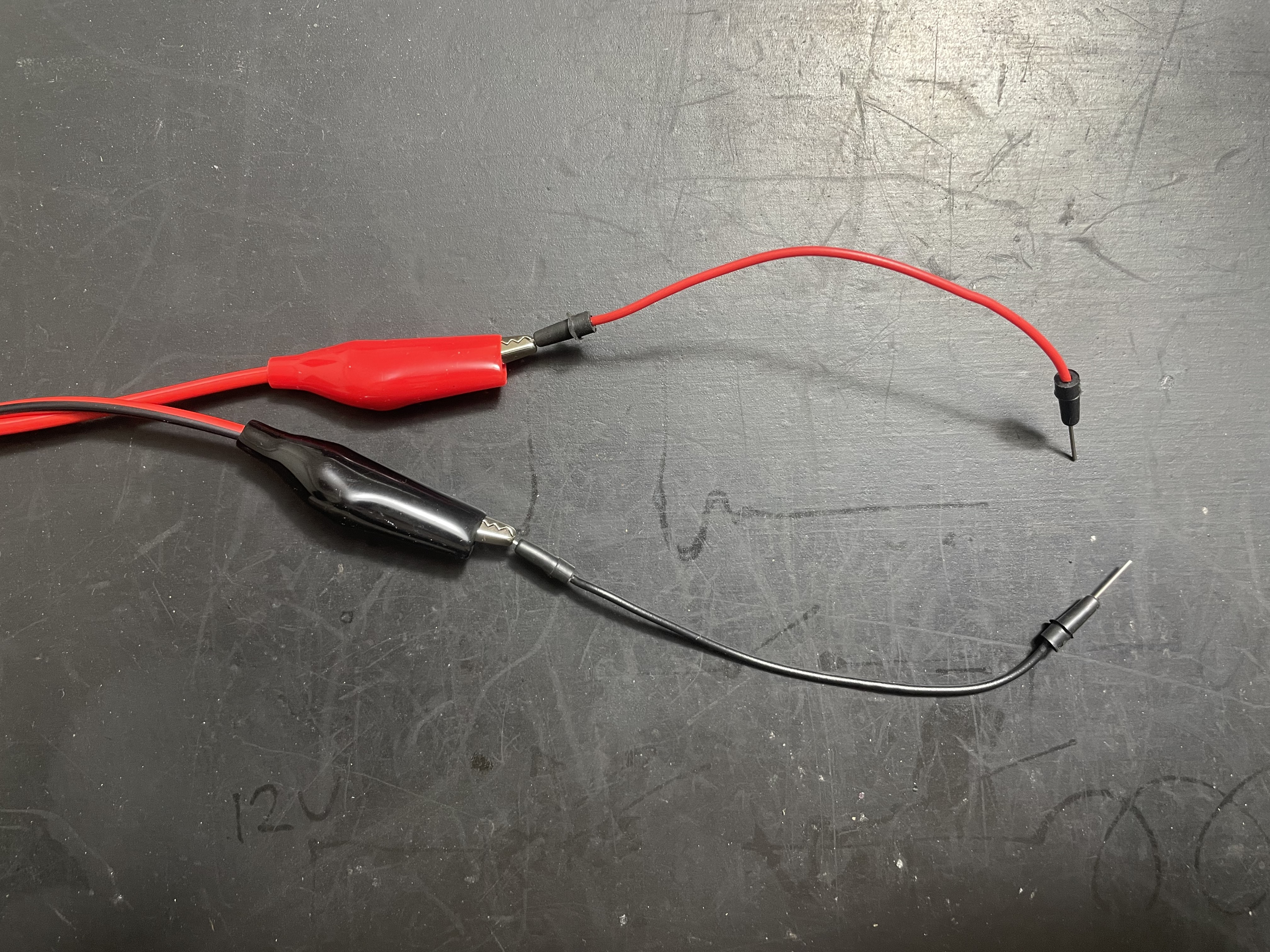 With Dupont-style wires you can have crocodile clips connected to a breadboard.