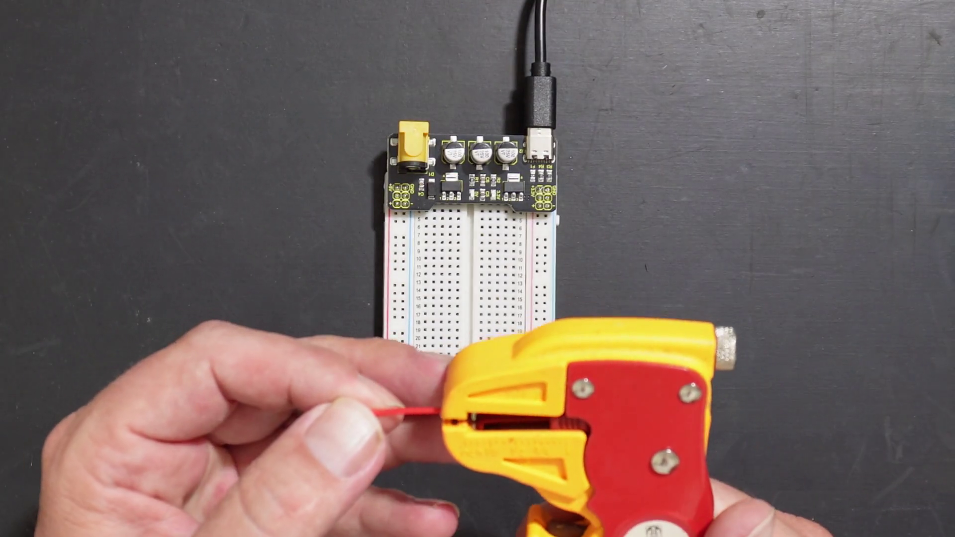 Stripping a wire.
