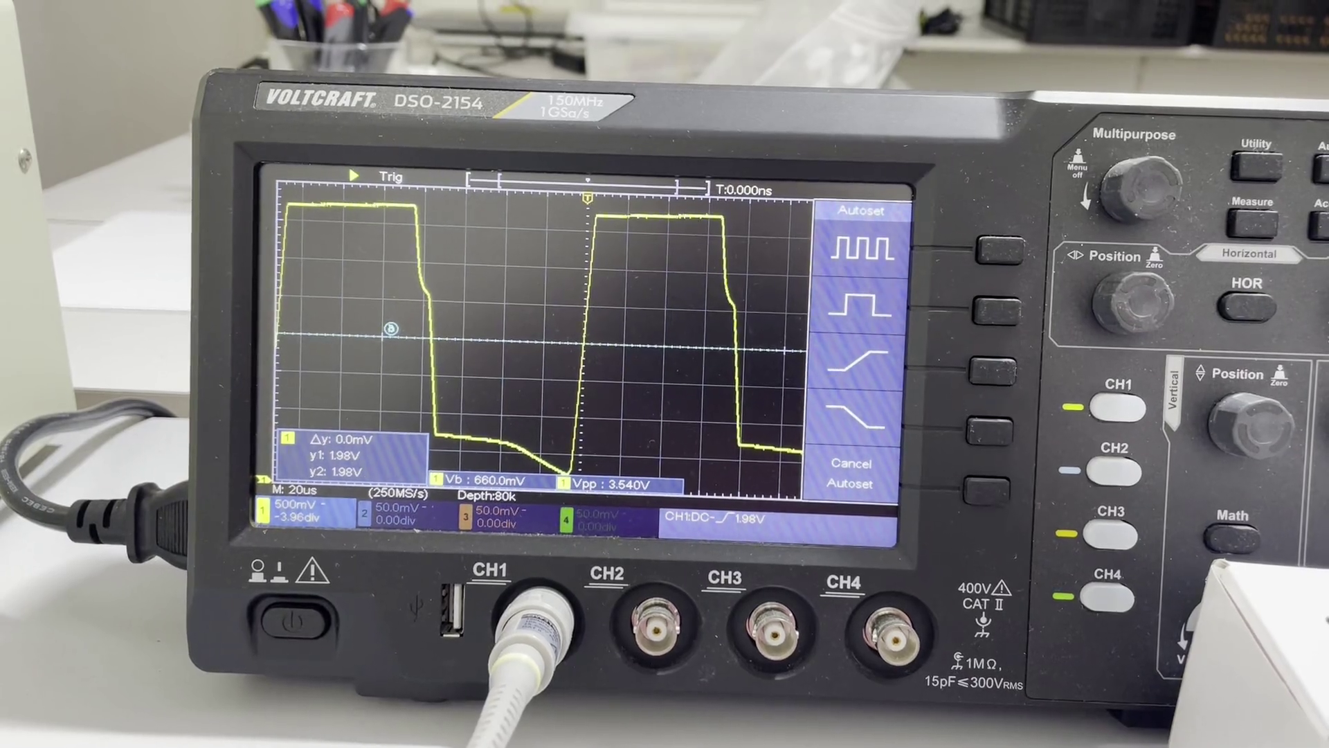 Oscilloscope showing an almost square wave signal coming from an oscillator circuit.