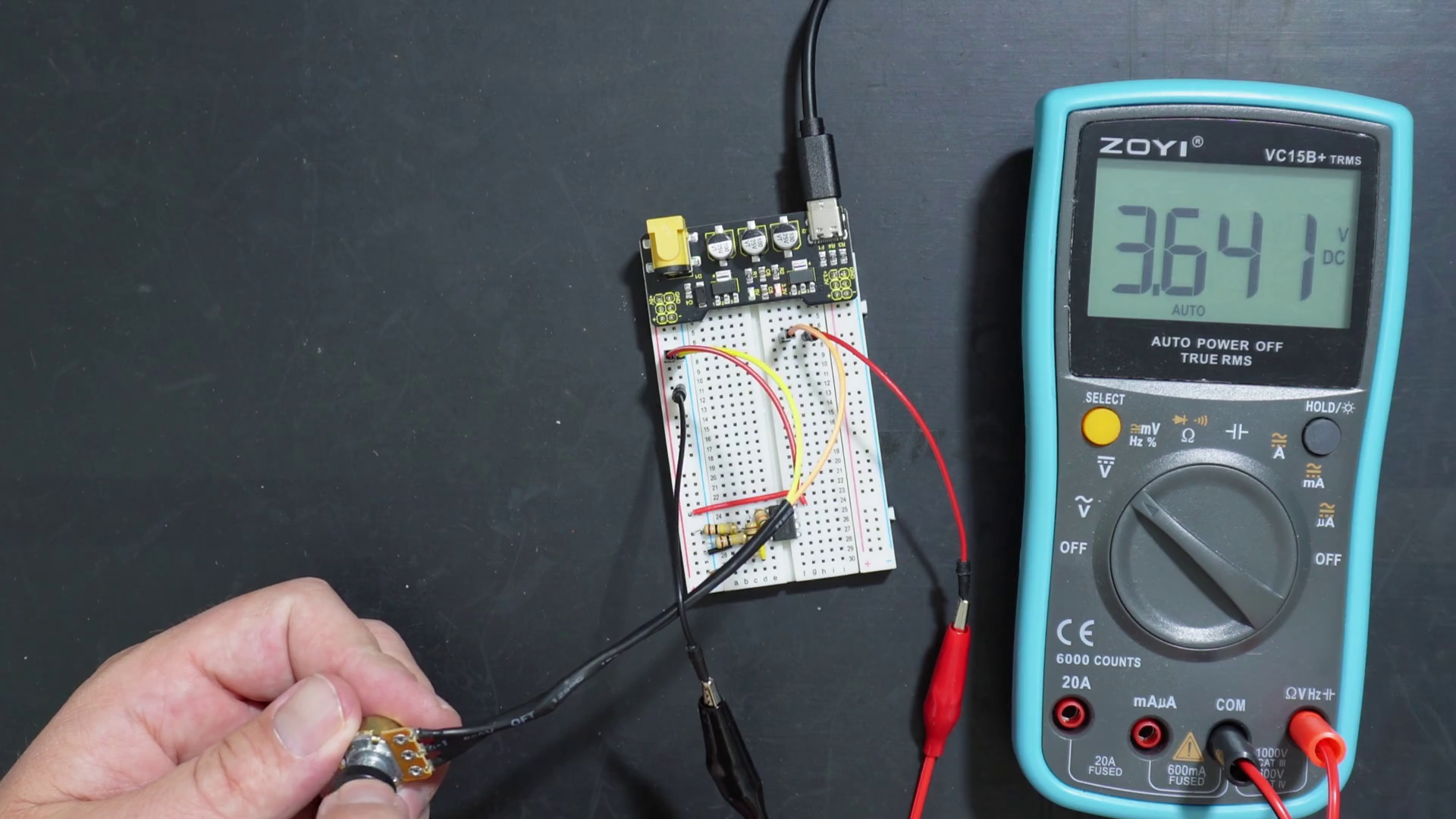 Testing the potentiometer output voltage going into PWM generator circuit on a breadboard.