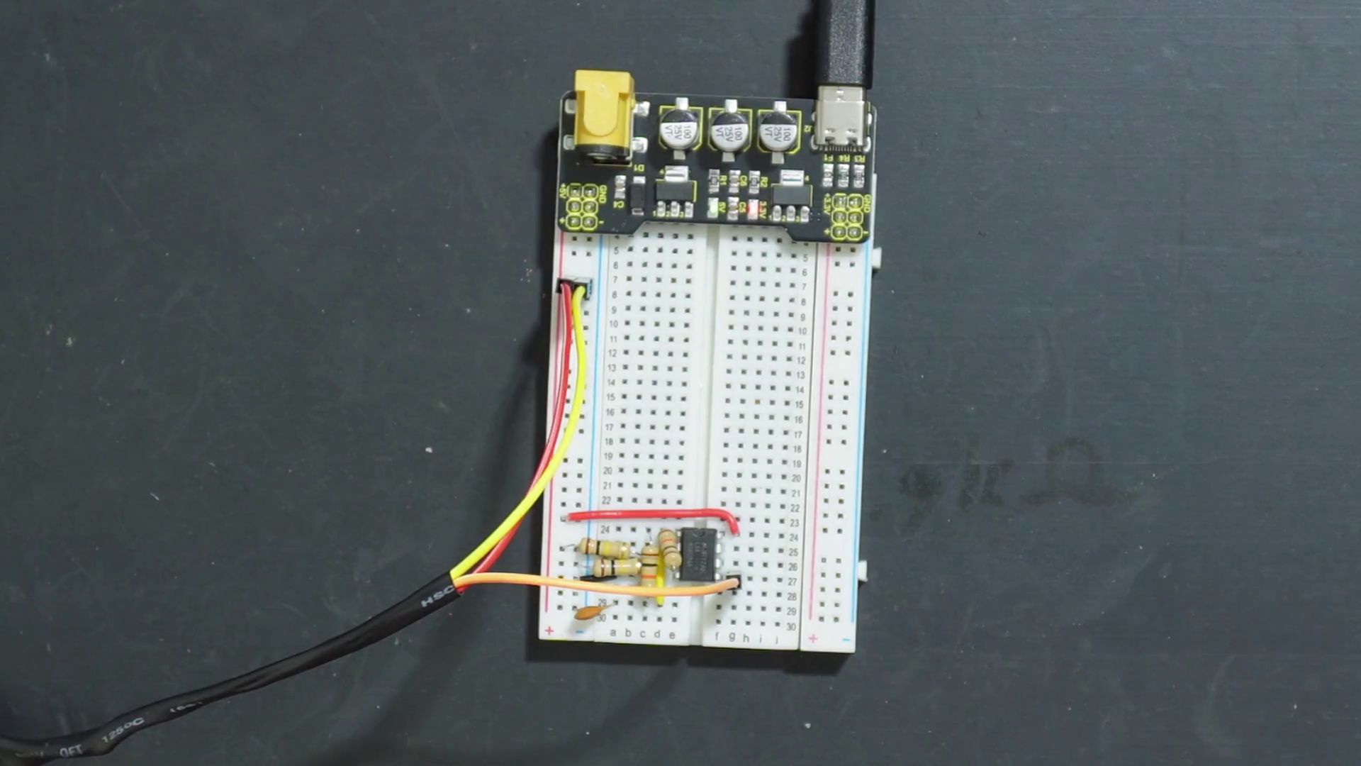 Potentiometer attached to variable PWM generator circuit on a breadboard.